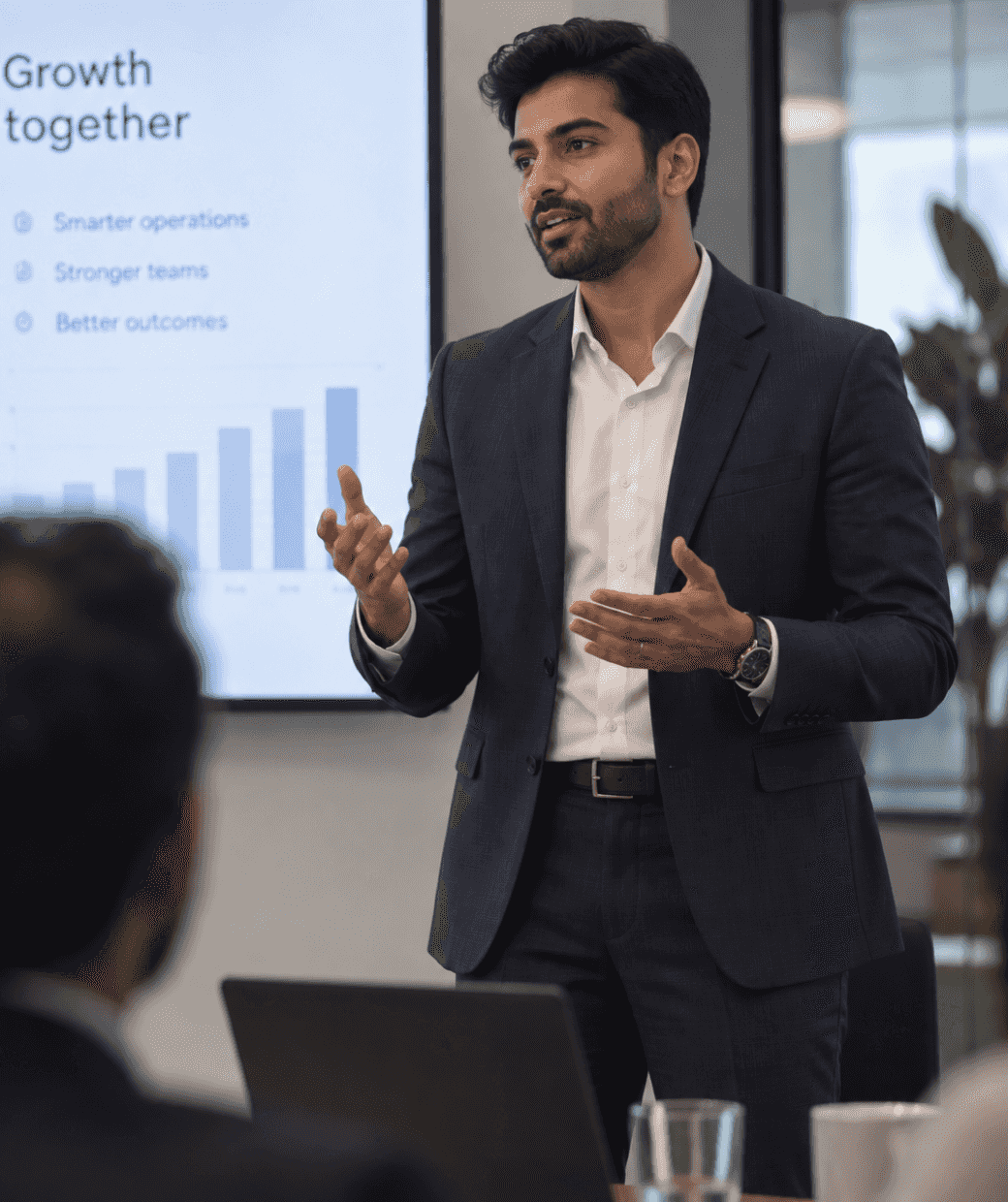 A professional presenting growth and team performance goals to colleagues.