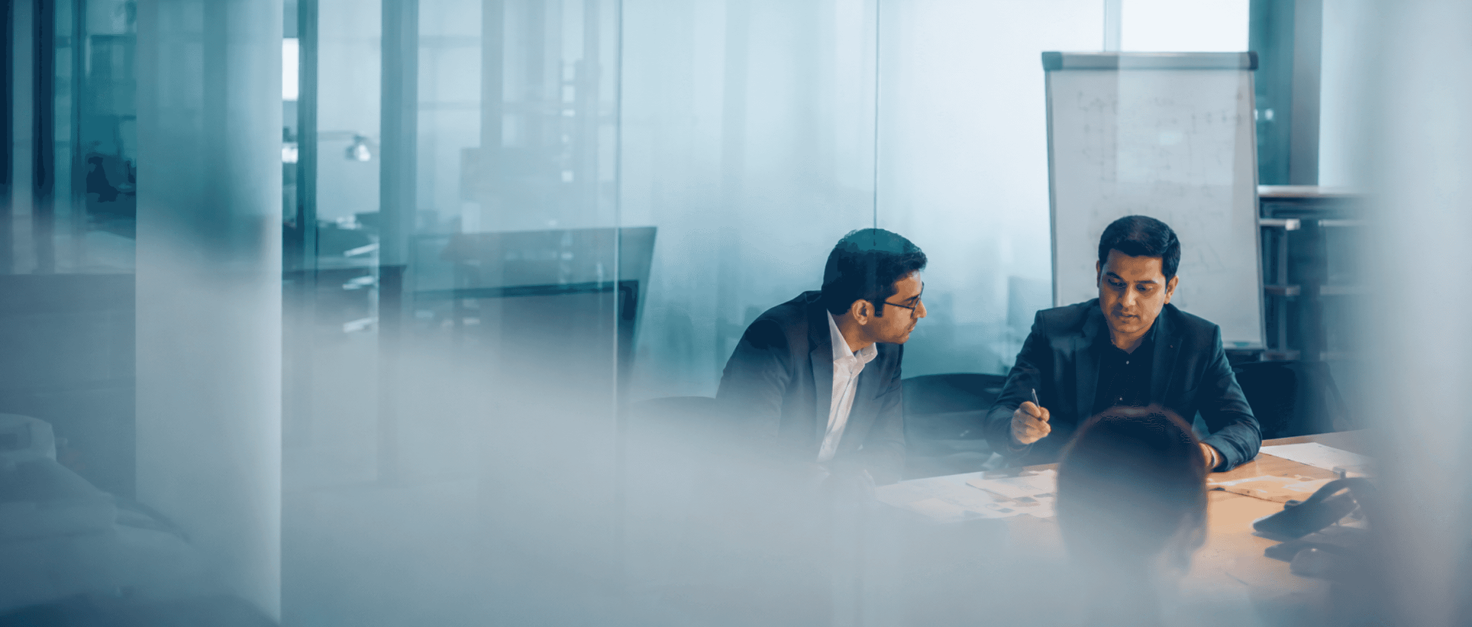 InVenire leaders reviewing financial results in a boardroom.