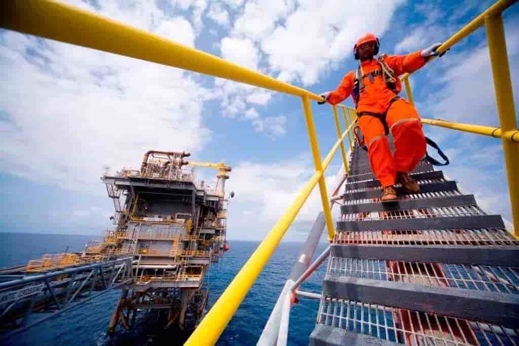 An InVenire offshore operator descending a platform stairway.