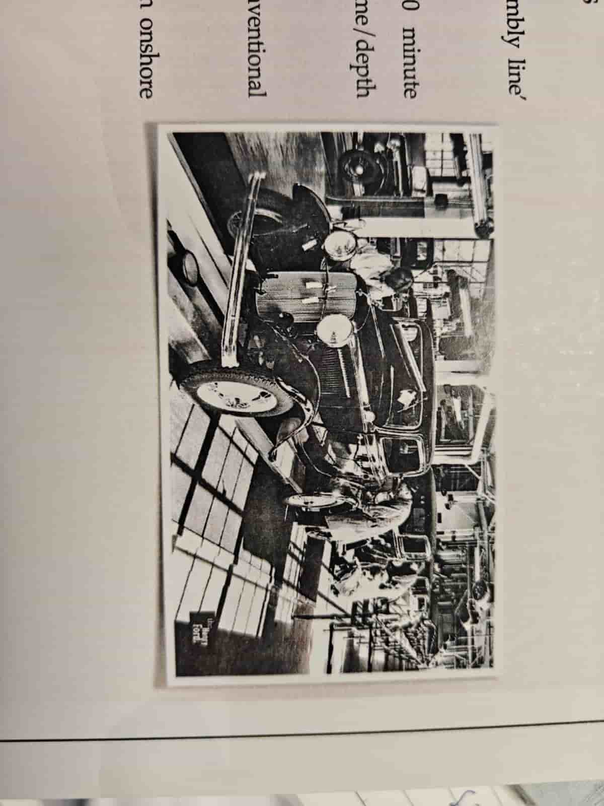 Historic automotive assembly line illustrating assembly-line drilling operations.
